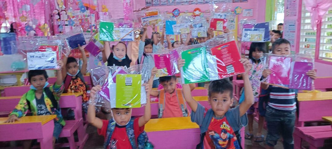 Pupils at Balabag holding new books